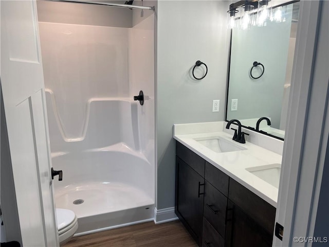 1 Johnville Rd, Dunnsville, VA 22454 - full bathroom with a shower, double vanity, wood finished floors, and toilet