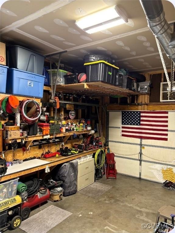 6778 Sassafras Dr, Quinton, VA 23141 - garage featuring a workshop area