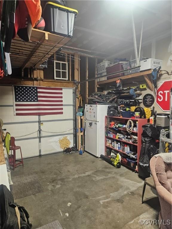 6778 Sassafras Dr, Quinton, VA 23141 - garage featuring freestanding refrigerator