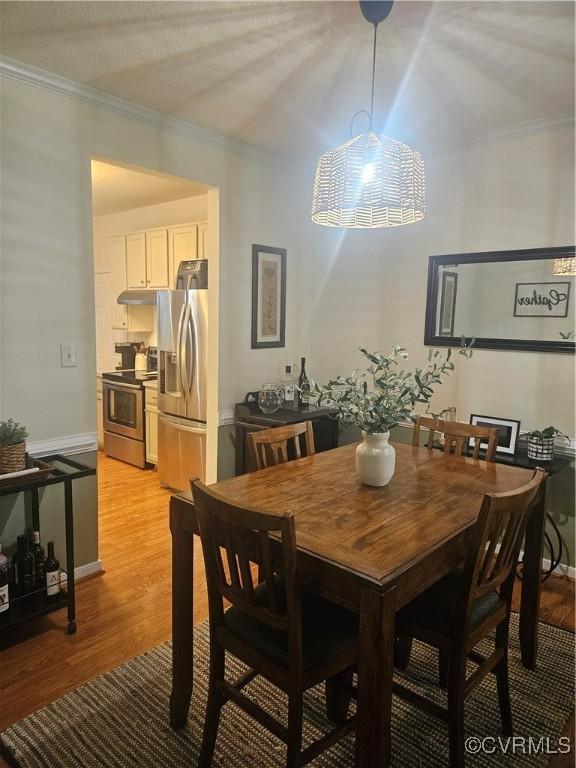 6778 Sassafras Dr, Quinton, VA 23141 - dining room featuring crown molding, light wood-type flooring, and baseboards