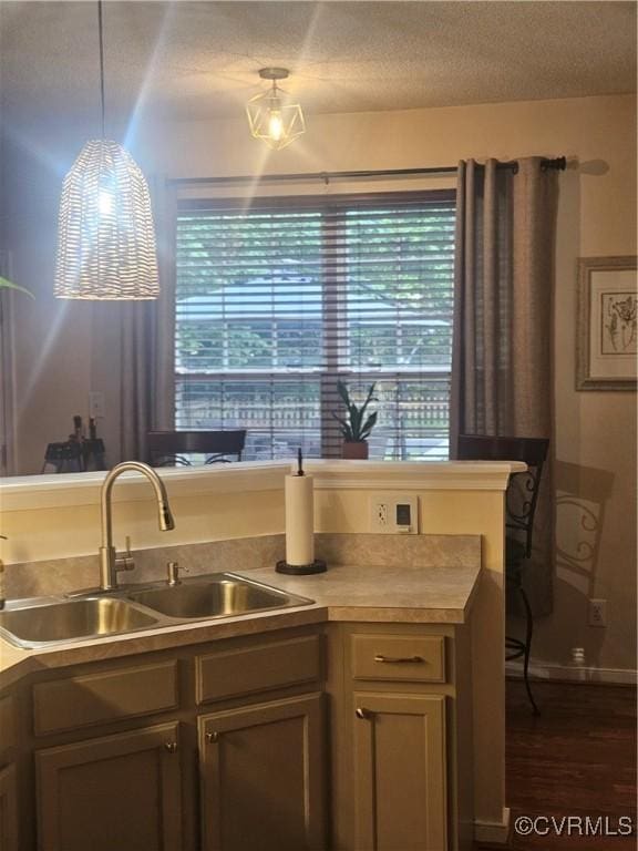 6778 Sassafras Dr, Quinton, VA 23141 - kitchen featuring a sink, dark wood-style flooring, light countertops, a textured ceiling, and baseboards