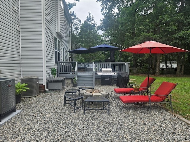 6778 Sassafras Dr, Quinton, VA 23141 - view of patio featuring an outdoor fire pit, a wooden deck, central air condition unit, and grilling area