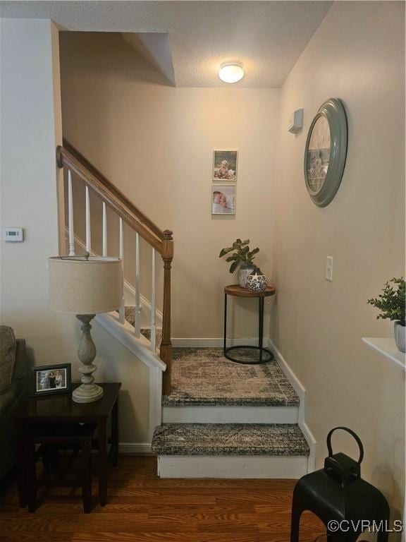6778 Sassafras Dr, Quinton, VA 23141 - stairs featuring wood finished floors and baseboards