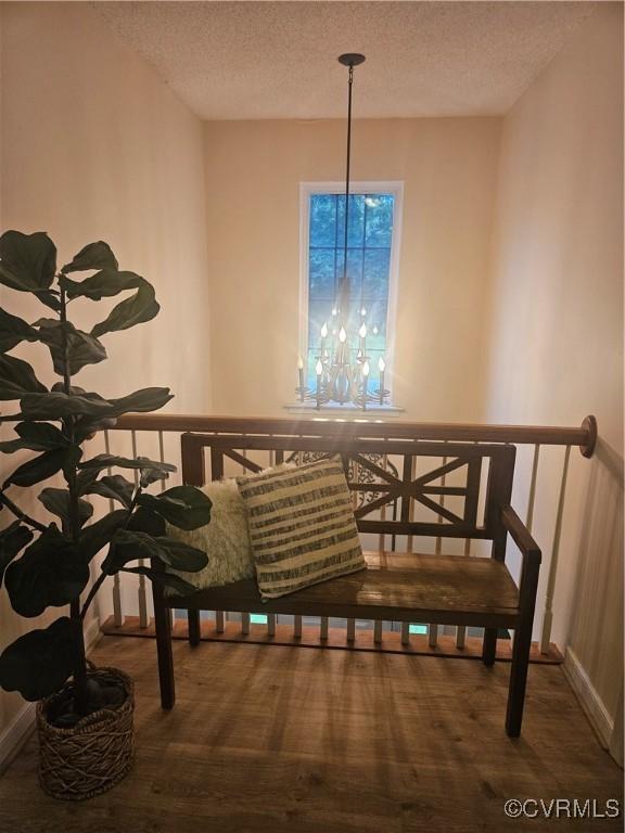 6778 Sassafras Dr, Quinton, VA 23141 - dining room featuring a textured ceiling, wood finished floors, and baseboards
