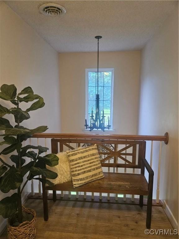 6778 Sassafras Dr, Quinton, VA 23141 - dining area with wood finished floors, a textured ceiling, and baseboards