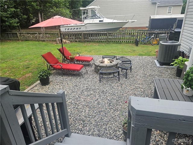 6778 Sassafras Dr, Quinton, VA 23141 - view of yard featuring a fire pit, central AC unit, and a patio area