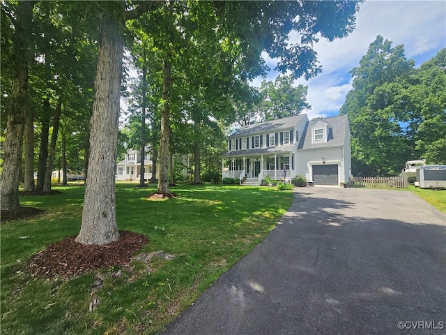6778 Sassafras Dr, Quinton, VA 23141 - colonial inspired home featuring a porch, driveway, and an attached garage