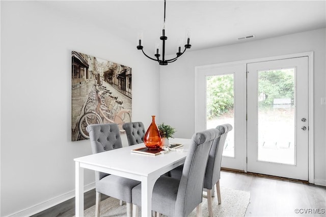 2222 Binford Ln, Richmond, VA 23223 - dining room with a chandelier and light wood-style floors
