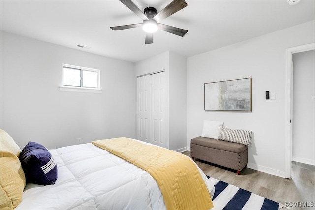 2222 Binford Ln, Richmond, VA 23223 - bedroom featuring wood finished floors, a closet, baseboards, and a ceiling fan