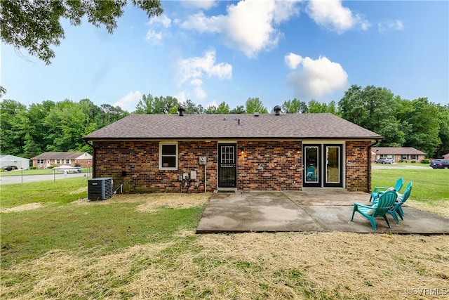 2222 Binford Ln, Richmond, VA 23223 - back of property featuring a patio, cooling unit, a yard, and brick siding
