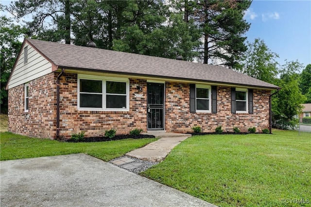 2222 Binford Ln, Richmond, VA 23223 - single story home featuring brick siding, a front yard, and a shingled roof