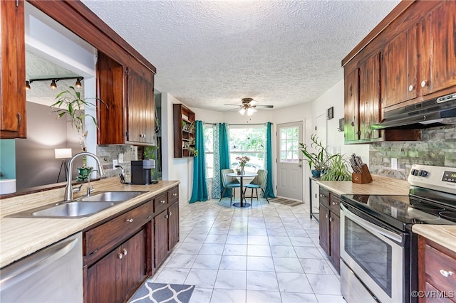 4710 Mason Rest Ct, Chesterfield, VA 23234 - kitchen featuring appliances with stainless steel finishes, a sink, under cabinet range hood, light marble finish floors, and light countertops