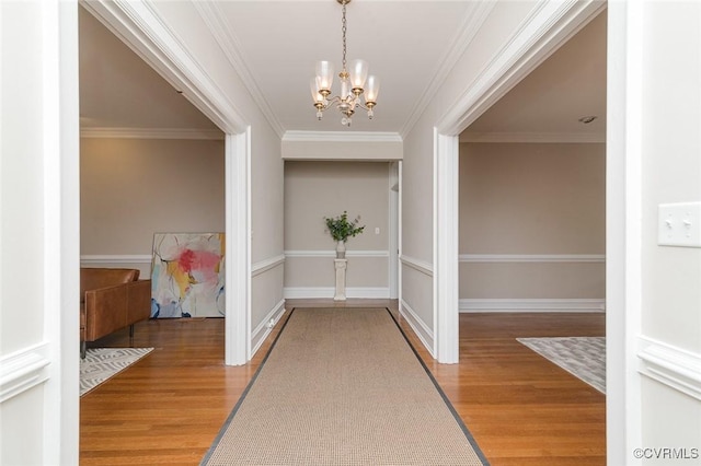 2923 Monument Ave Unit 1, Richmond, VA 23221 - corridor with a chandelier, light wood-type flooring, crown molding, and baseboards