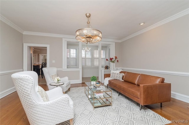 2923 Monument Ave Unit 1, Richmond, VA 23221 - living area featuring a chandelier, wood finished floors, crown molding, and baseboards