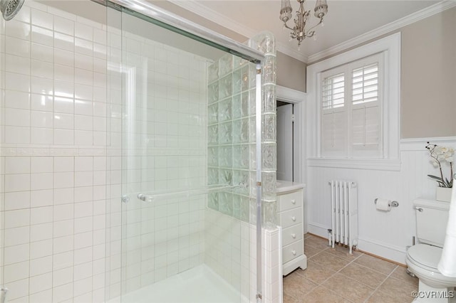 2923 Monument Ave Unit 1, Richmond, VA 23221 - bathroom featuring radiator heating unit, a shower stall, toilet, tile patterned flooring, and crown molding