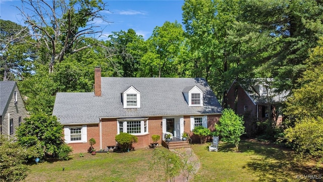 1743 Johnson Rd, Petersburg, VA 23805 - cape cod home with brick siding, a front lawn, and a chimney