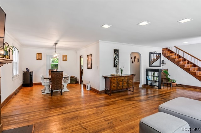 1743 Johnson Rd, Petersburg, VA 23805 - living area featuring stairway, hardwood / wood-style flooring, arched walkways, crown molding, and baseboards