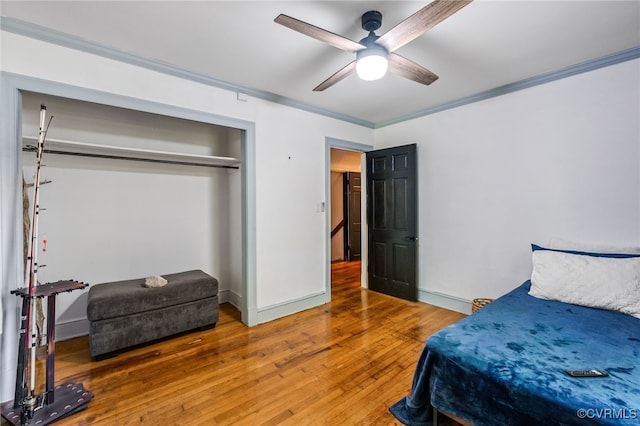 1743 Johnson Rd, Petersburg, VA 23805 - bedroom featuring crown molding, hardwood / wood-style flooring, a ceiling fan, baseboards, and a closet
