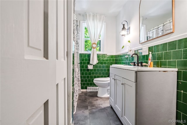 1743 Johnson Rd, Petersburg, VA 23805 - full bathroom with tile walls, vanity, toilet, wainscoting, and concrete flooring