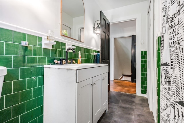 1743 Johnson Rd, Petersburg, VA 23805 - bathroom featuring tile walls, vanity, and a wainscoted wall