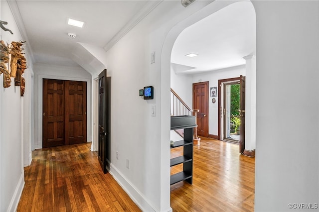 1743 Johnson Rd, Petersburg, VA 23805 - hall featuring stairs, hardwood / wood-style floors, arched walkways, baseboards, and ornamental molding