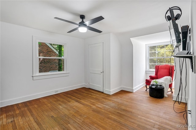 1743 Johnson Rd, Petersburg, VA 23805 - unfurnished room featuring wood-type flooring, healthy amount of natural light, baseboards, and ceiling fan
