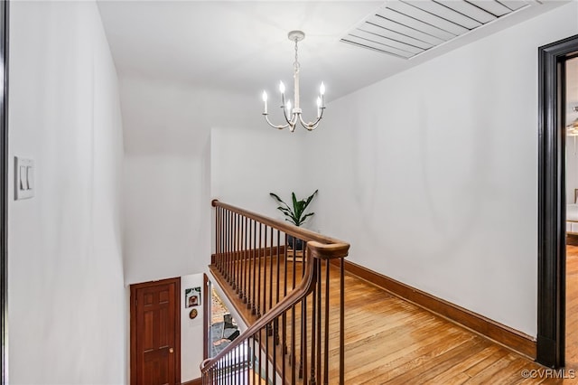 1743 Johnson Rd, Petersburg, VA 23805 - stairway with hardwood / wood-style flooring, a chandelier, and baseboards