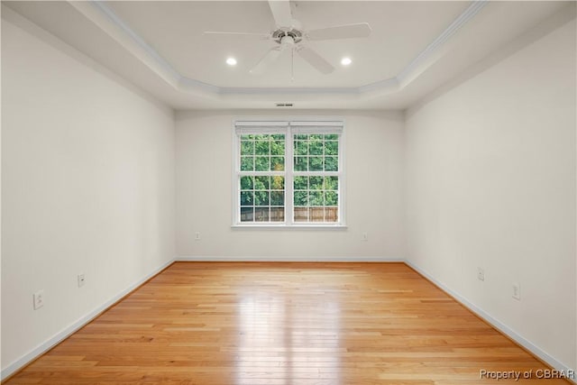 3907 Currier Ct, Chester, VA 23831 - spare room with a tray ceiling, light wood-style flooring, ceiling fan, crown molding, and baseboards