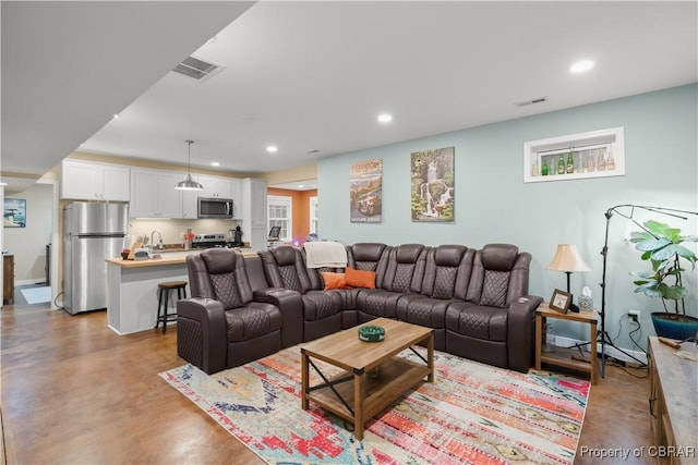 3907 Currier Ct, Chester, VA 23831 - living room with finished concrete flooring and recessed lighting