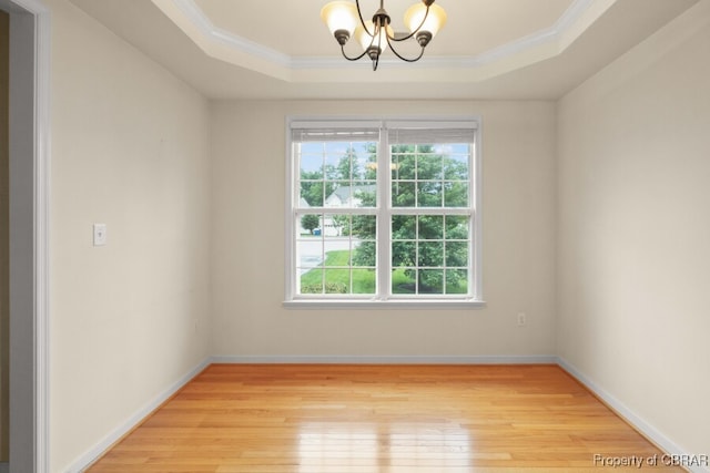 3907 Currier Ct, Chester, VA 23831 - unfurnished room with a chandelier, a raised ceiling, light wood-style flooring, crown molding, and baseboards