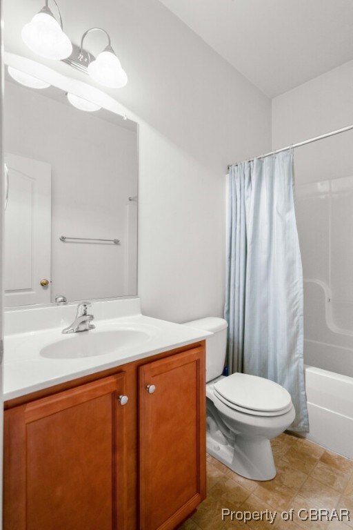 3907 Currier Ct, Chester, VA 23831 - bathroom featuring vanity, toilet, and shower / tub combo