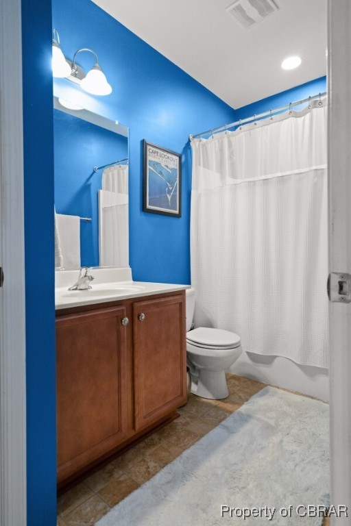 3907 Currier Ct, Chester, VA 23831 - bathroom with toilet, vanity, and shower / bath combo with shower curtain