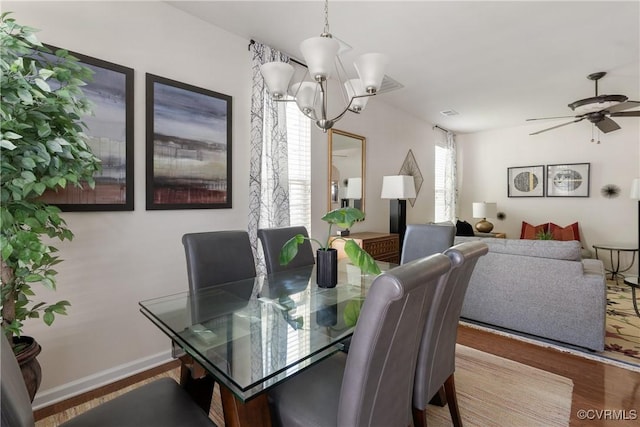 8910 Ringview Dr, Mechanicsville, VA 23116 - dining room featuring wood finished floors, a chandelier, baseboards, and a ceiling fan