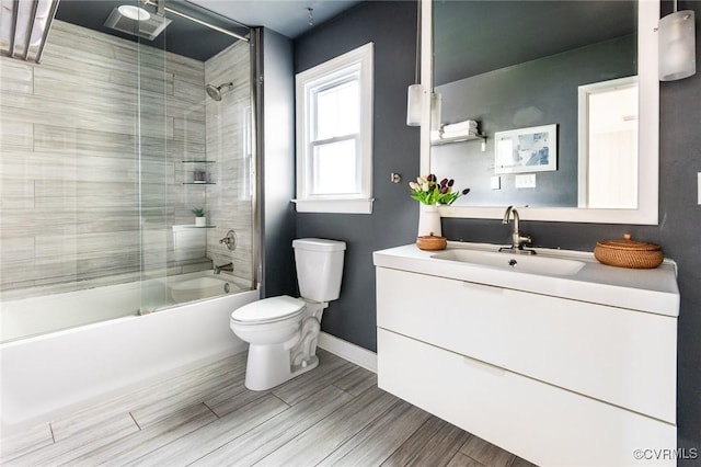 1708 Michaels Rd, Henrico, VA 23229 - bathroom with toilet, enclosed tub / shower combo, vanity, baseboards, and wood finished floors