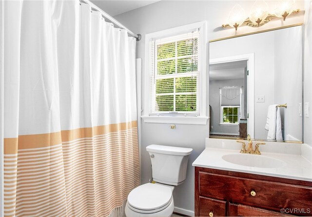 1724 Villageway Dr, Henrico, VA 23229 - bathroom featuring vanity, toilet, plenty of natural light, and curtained shower