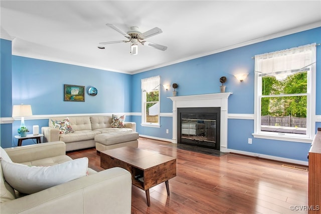 1724 Villageway Dr, Henrico, VA 23229 - living area featuring a ceiling fan, a fireplace with flush hearth, wood finished floors, ornamental molding, and baseboards