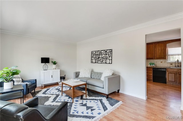7611 Comanche Dr, Richmond, VA 23225 - living area featuring crown molding, light wood-type flooring, and baseboards