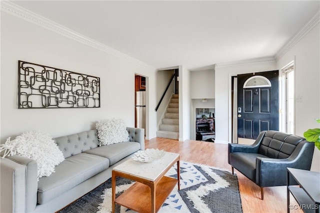 7611 Comanche Dr, Richmond, VA 23225 - living area featuring crown molding, stairway, and wood finished floors