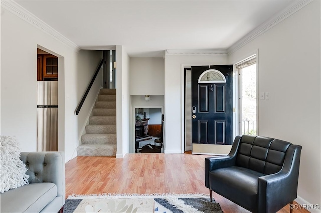 7611 Comanche Dr, Richmond, VA 23225 - entrance foyer with stairs, wood finished floors, crown molding, and baseboards