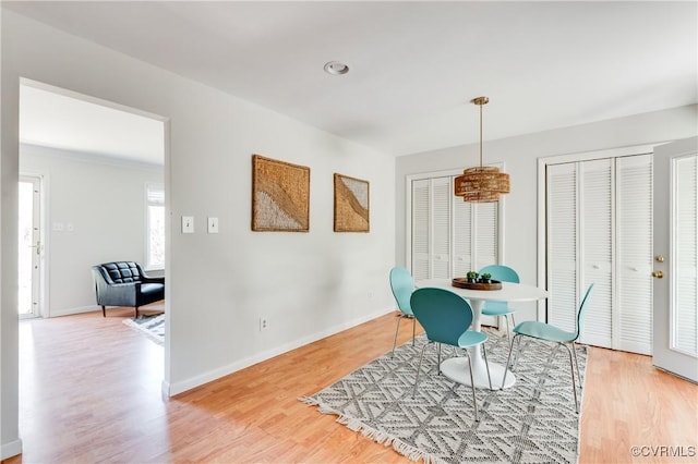 7611 Comanche Dr, Richmond, VA 23225 - dining area featuring light wood-style floors, baseboards, and a chandelier