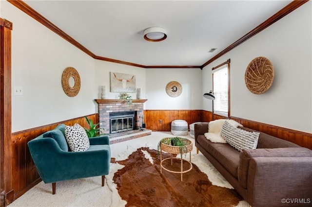 7611 Comanche Dr, Richmond, VA 23225 - carpeted living area featuring wood walls, wainscoting, crown molding, and a brick fireplace