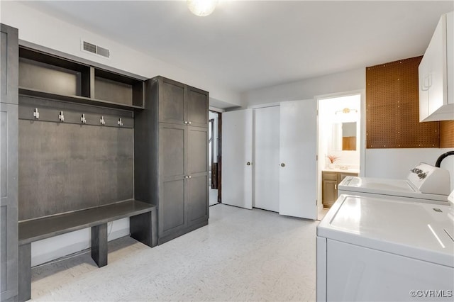 7611 Comanche Dr, Richmond, VA 23225 - laundry area with cabinet space and washer and dryer