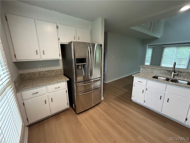 7821 Breaker Point Ct, Chesterfield, VA 23832 - kitchen featuring stainless steel fridge, a sink, light wood finished floors, and white cabinetry