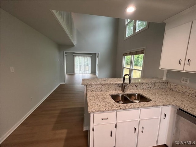 7821 Breaker Point Ct, Chesterfield, VA 23832 - kitchen with a sink, white cabinetry, baseboards, dark wood finished floors, and light stone countertops