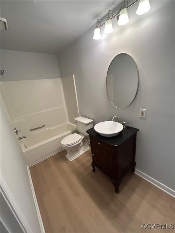 7821 Breaker Point Ct, Chesterfield, VA 23832 - full bathroom with vanity, toilet, shower / washtub combination, and wood finished floors