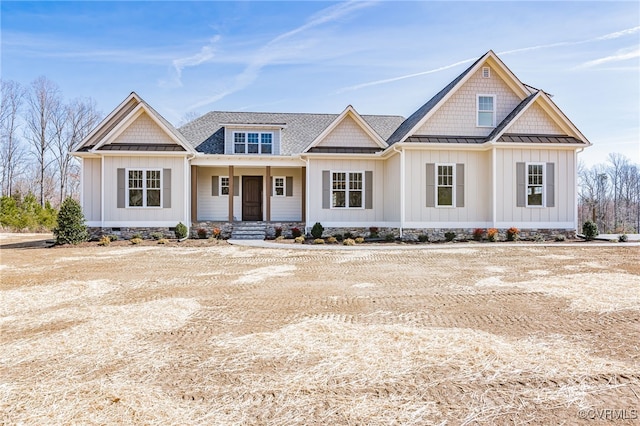 1555 Smokey Ridge Rd, Maidens, VA 23102 - view of front of home with board and batten siding, a standing seam roof, covered porch, and metal roof