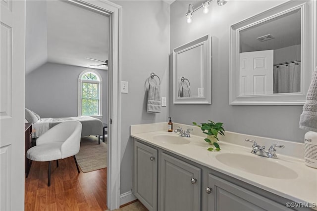 14136 Rigney Dr, Midlothian, VA 23113 - ensuite bathroom with double vanity, lofted ceiling, and wood finished floors