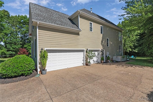 14136 Rigney Dr, Midlothian, VA 23113 - view of side of property featuring driveway, an attached garage, and a shingled roof