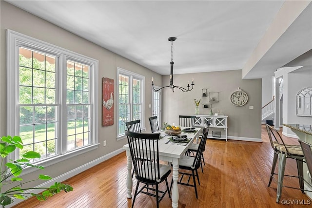 14136 Rigney Dr, Midlothian, VA 23113 - dining room featuring baseboards, wood-type flooring, stairway, and a chandelier