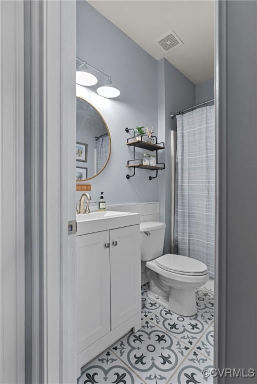 14136 Rigney Dr, Midlothian, VA 23113 - bathroom with vanity, toilet, and tile patterned floors